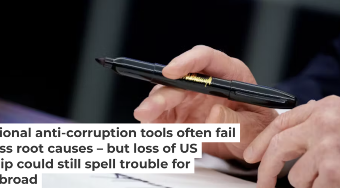 President Donald Trump signs a series of executive orders on Feb. 10, 2025, including an order relating to the Foreign Corrupt Practices Act. Andrew Harnik/Getty Images